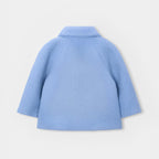 Cappotto teddy con borsetta.