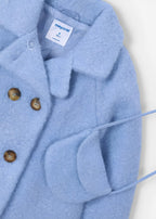 Cappotto teddy con borsetta.