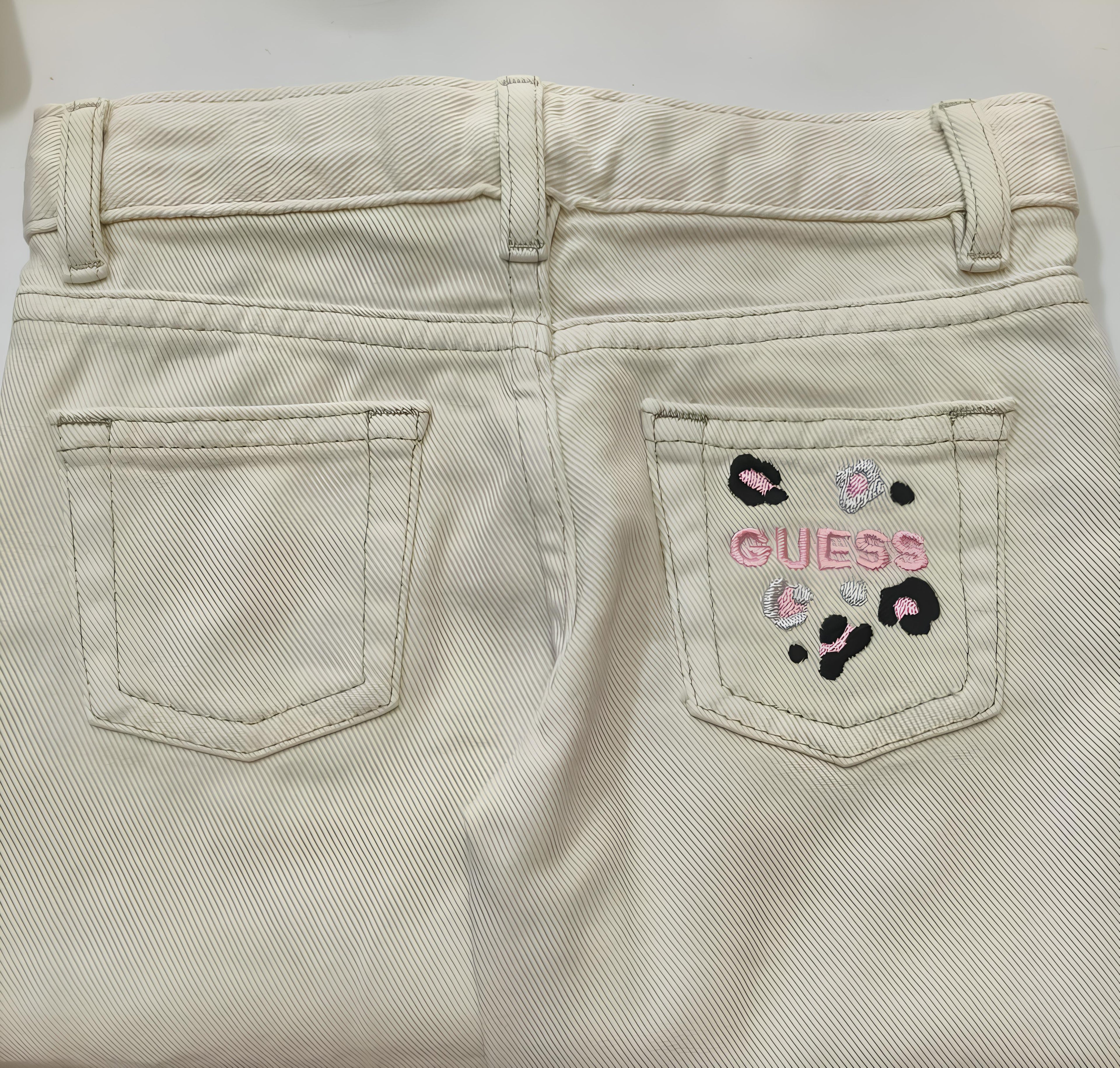 GUESS JEANS A PALAZZO BIMBA. COTONE.